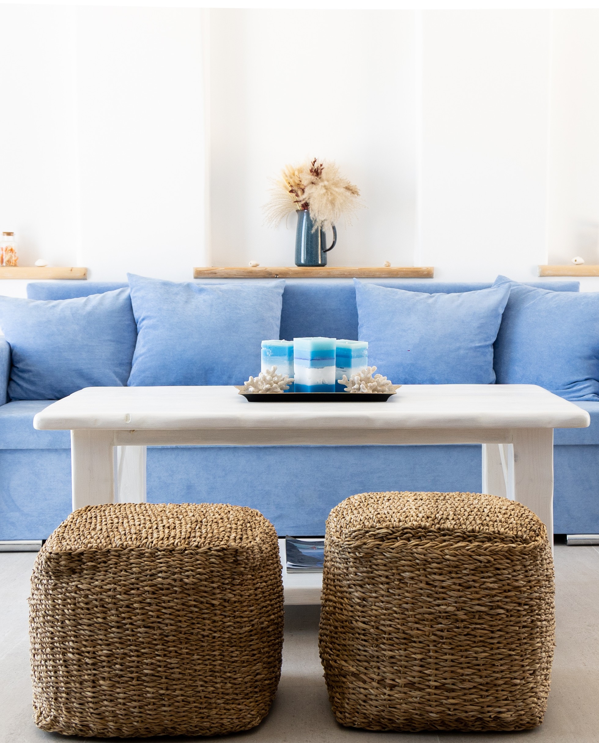 Minimal living room interior with blue sofa at Villa Manesi