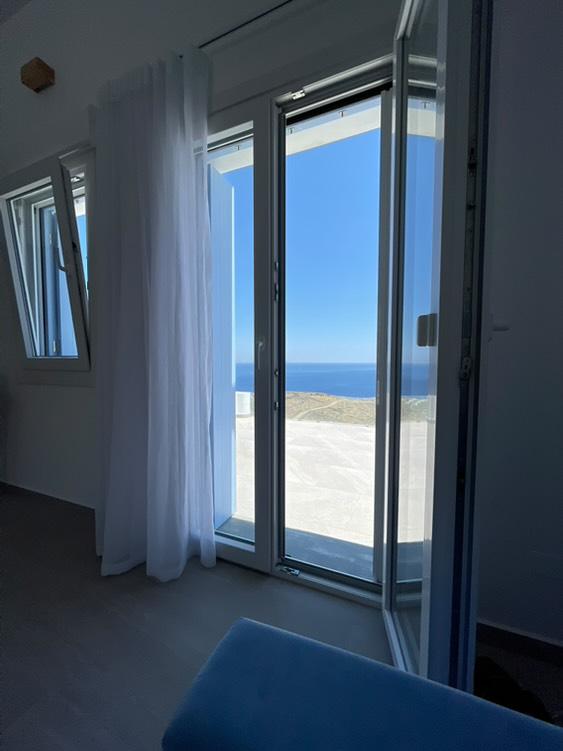 Sea view through private balcony doors at Villa Manesi, Kythnos