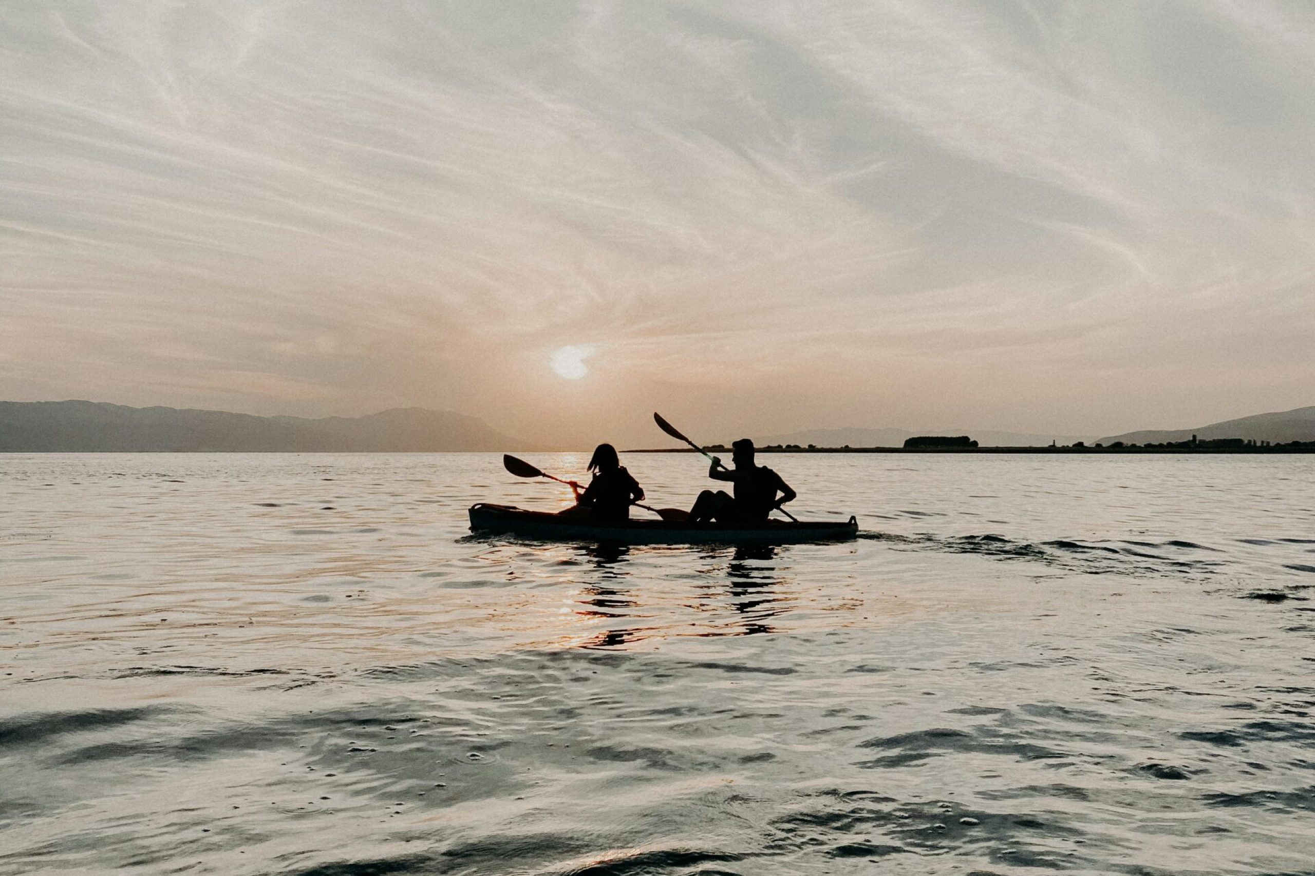 Kayaking at sunset in the calm waters